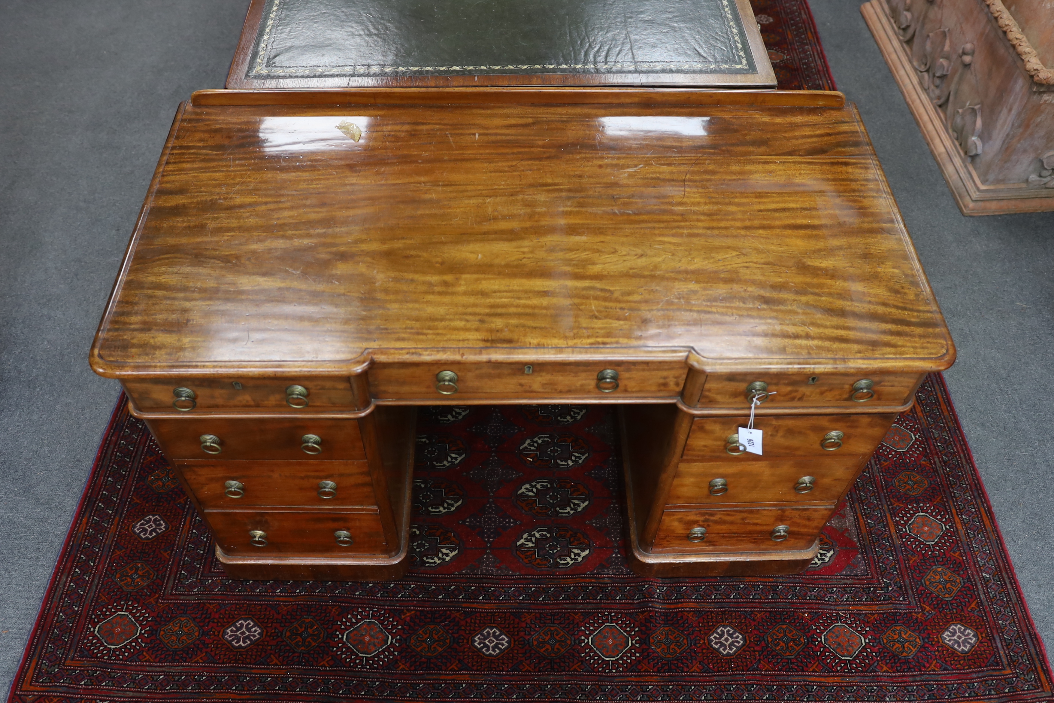 A Victorian mahogany Heal & Son, London inverse breakfront pedestal desk, width 122cm, depth 59cm, height 76cm
